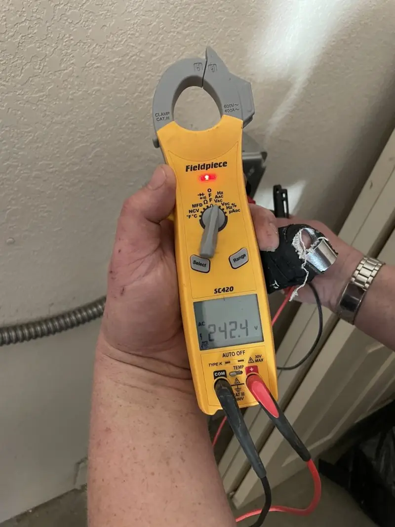 Voltage testing with clamp meter during Hot Tub / Pool Electrical Wiring in Moraine